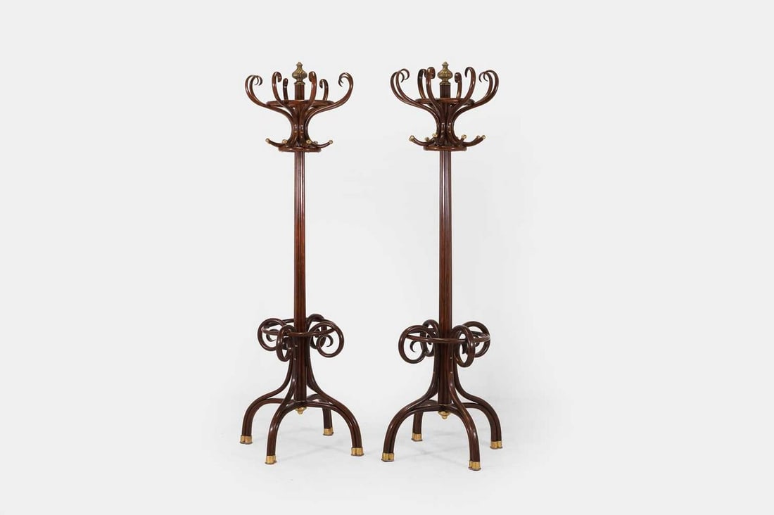 A pair of bentwood and brass-mounted coat stands, circa 1900, (1 of 4)