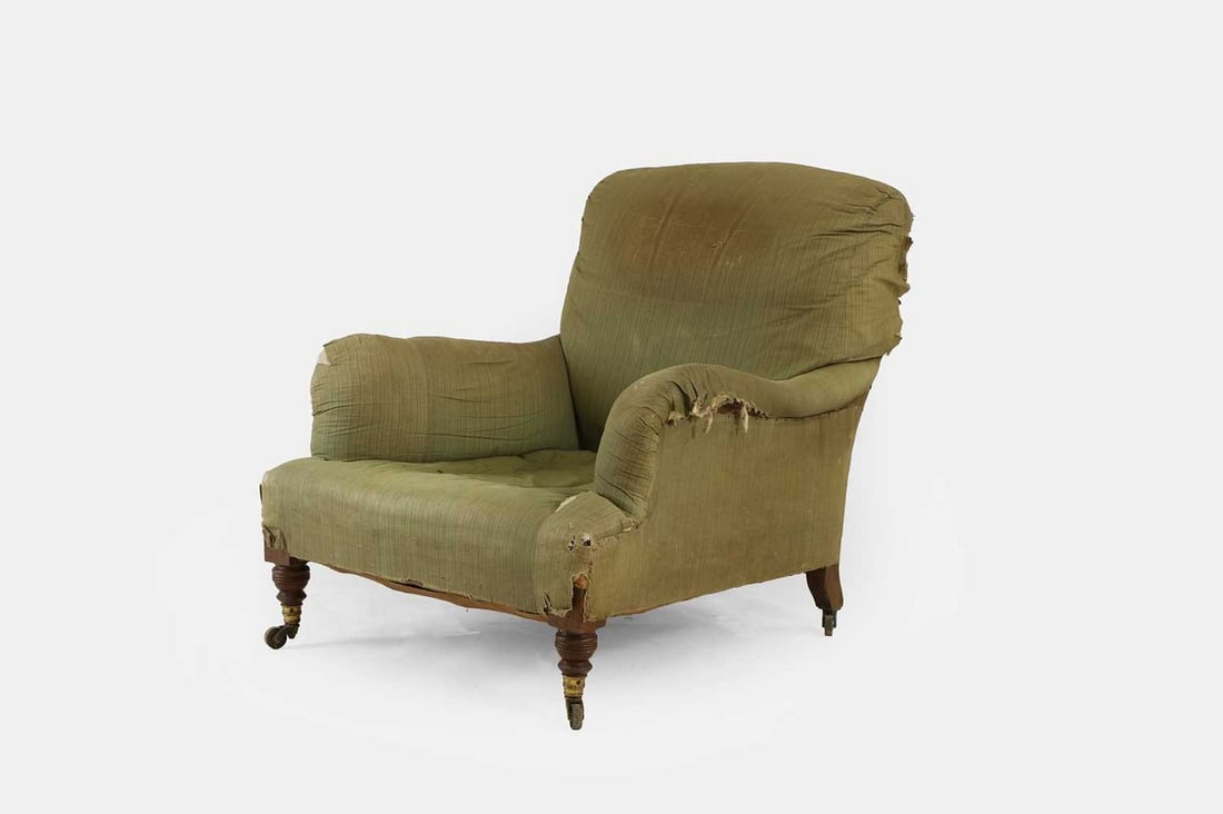 A late Victorian 'Grafton' armchair by Howard & Sons, circa 1890, (1 of 3)
