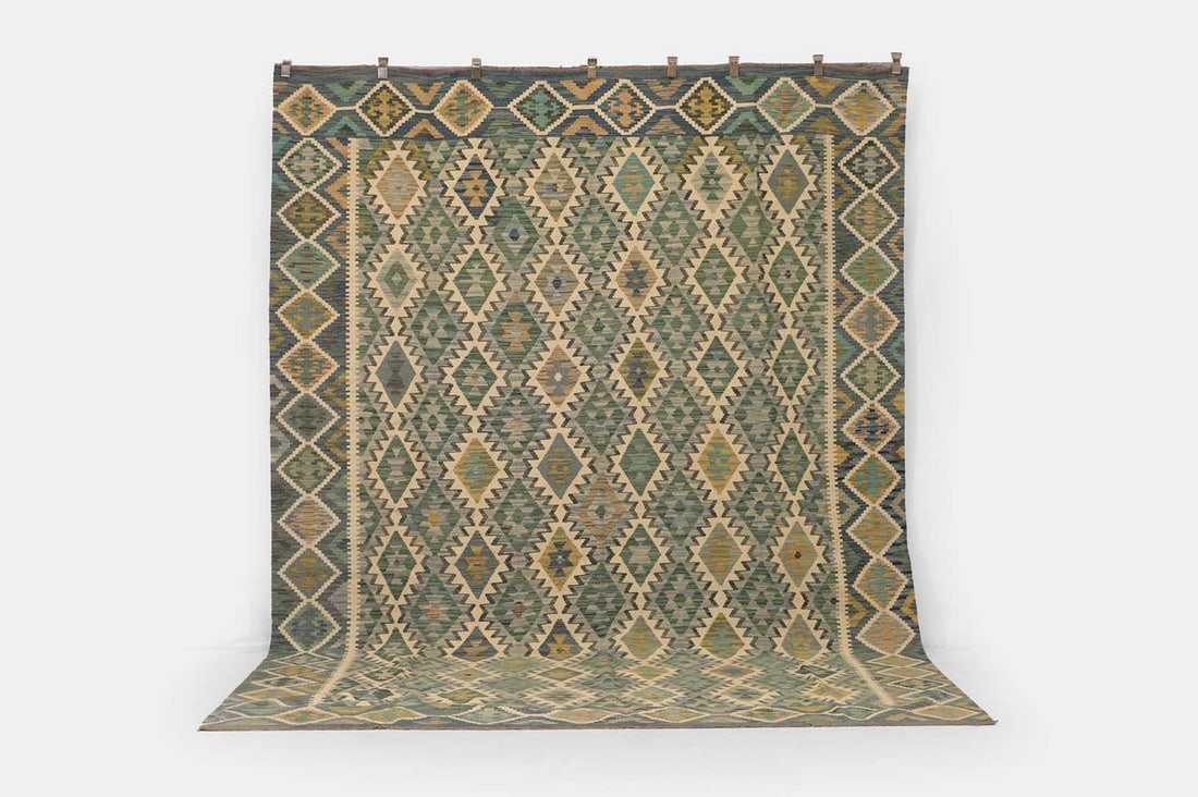 A flat-weave wool carpet of Anatolian design, of recent manufacture, (1 of 3)