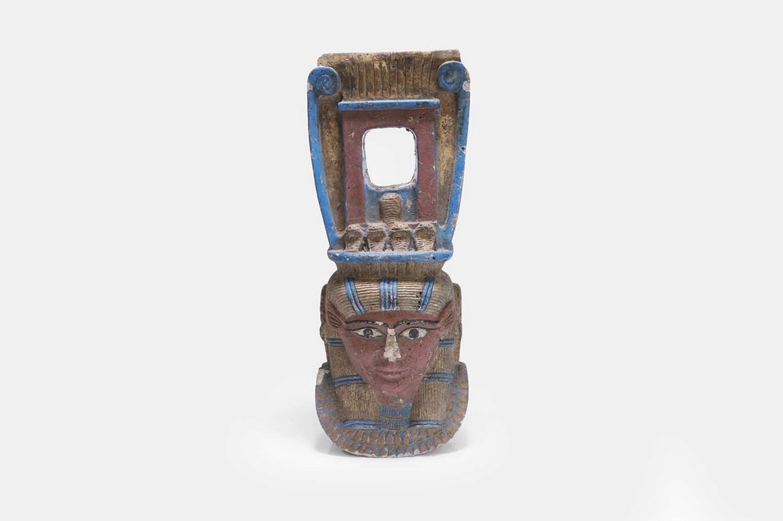 An Egyptian-style carved and painted quartz Hathor column capital, 20th century, (1 of 4)