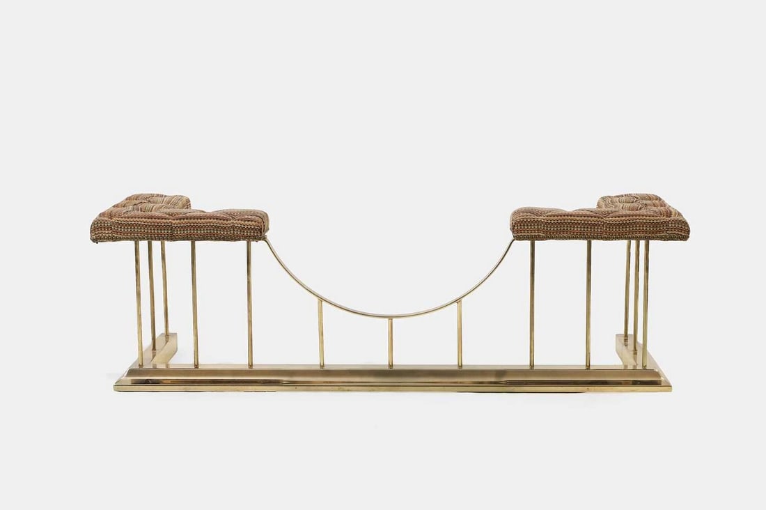 A polished steel club fender, 20th century,: A polished steel club fender, 20th century, the 'L'-shaped seats covered in buttoned polychrome upholstery (156cm wide, 53cm deep, 48cm high) Condition Report: Good condition overall. Upholstery with 