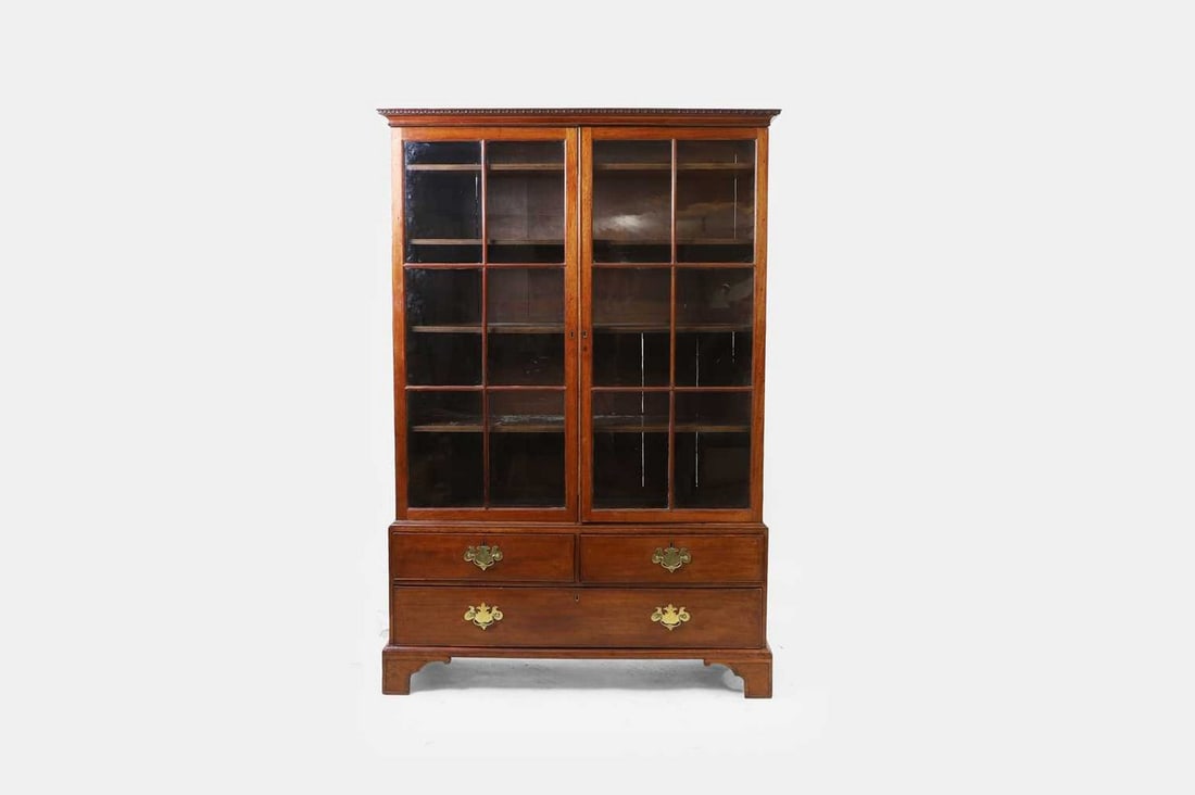 A small George II mahogany bookcase, second quarter of the 18th century, (1 of 2)