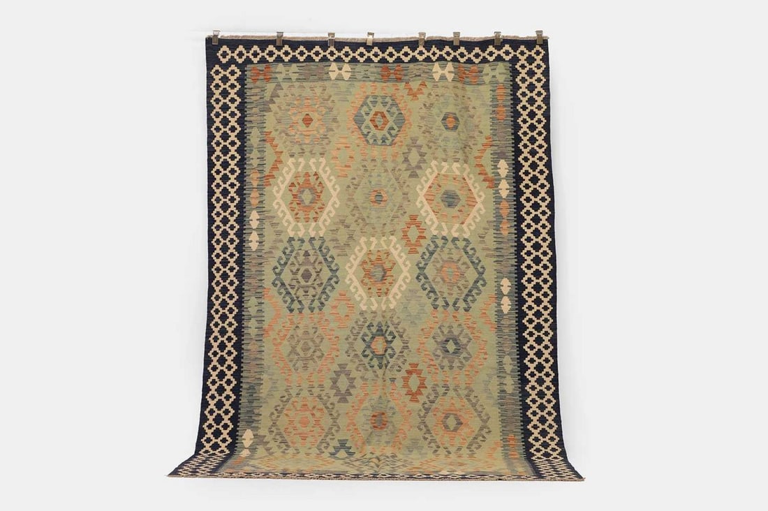 A flat-weave wool carpet of Anatolian design, of recent manufacture, (1 of 3)