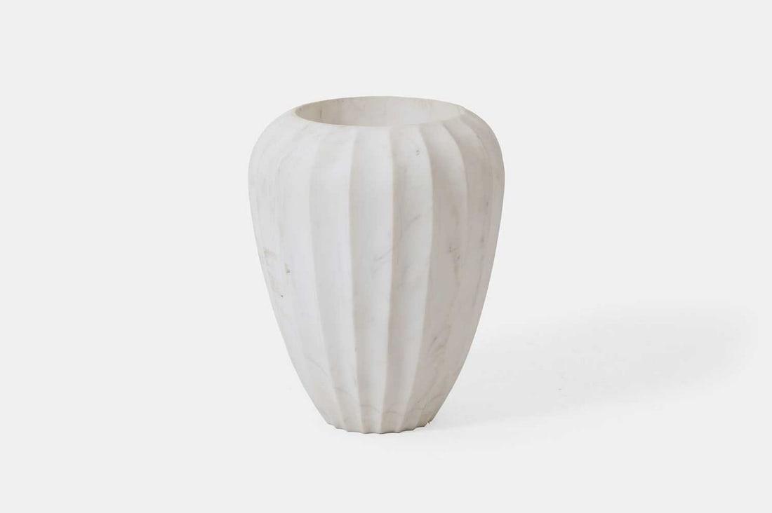 A marble vase by Kelly Wearstler, of recent manufacture,: A marble vase by Kelly Wearstler, of recent manufacture, of fluted and tapered form in white Calacatta marble (28cm diameter, 40cm high) Condition Report: General light surface wear and abrasions comm