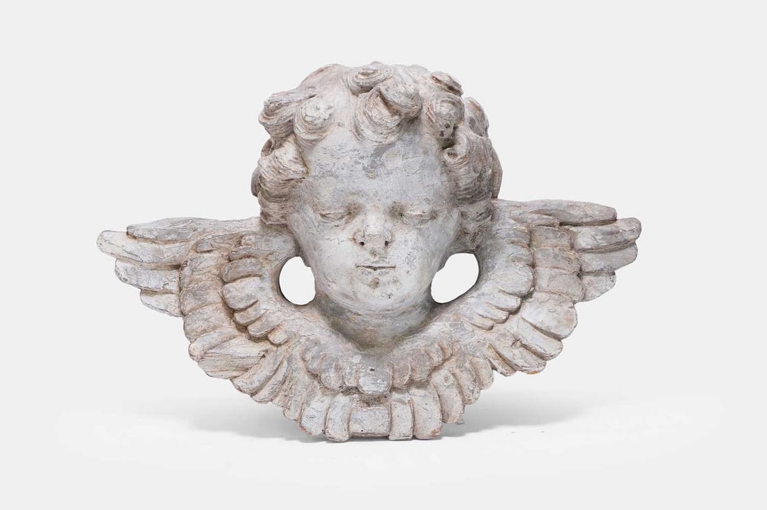 A carved wooden and painted cherub's head sculpture, late 18th/early 19th century, Continental, (1 of 3)