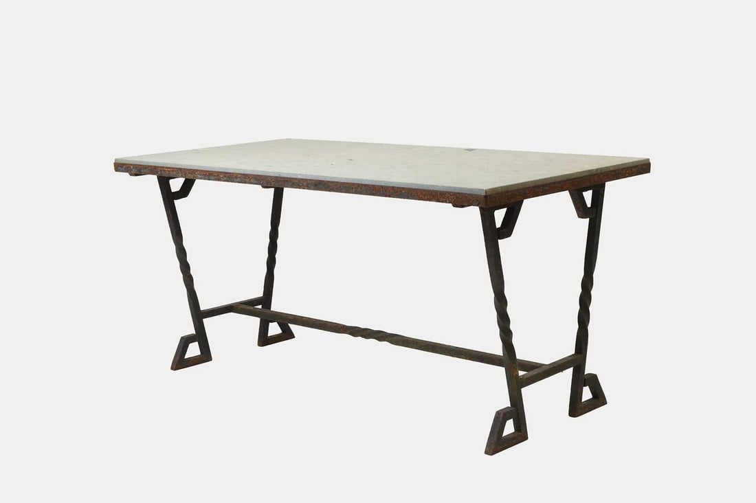 An iron-framed limestone garden table, 19th century and later,: An iron-framed limestone garden table, 19th century and later, the rectangular top raised on turned legs united by similar stretchers (131cm wide, 73cm deep, 69cm high)