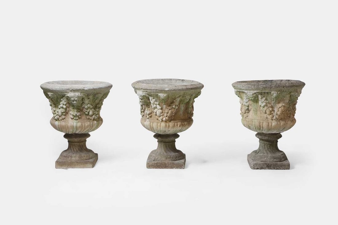 A set of three composite garden urns, 20th century, (1 of 3)