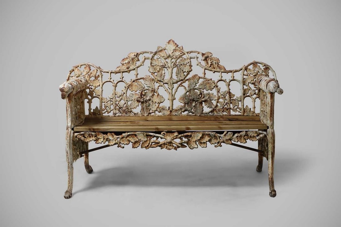 A cast iron garden bench, circa 1880 and later, in the manner of Coalbrookdale, (1 of 4)