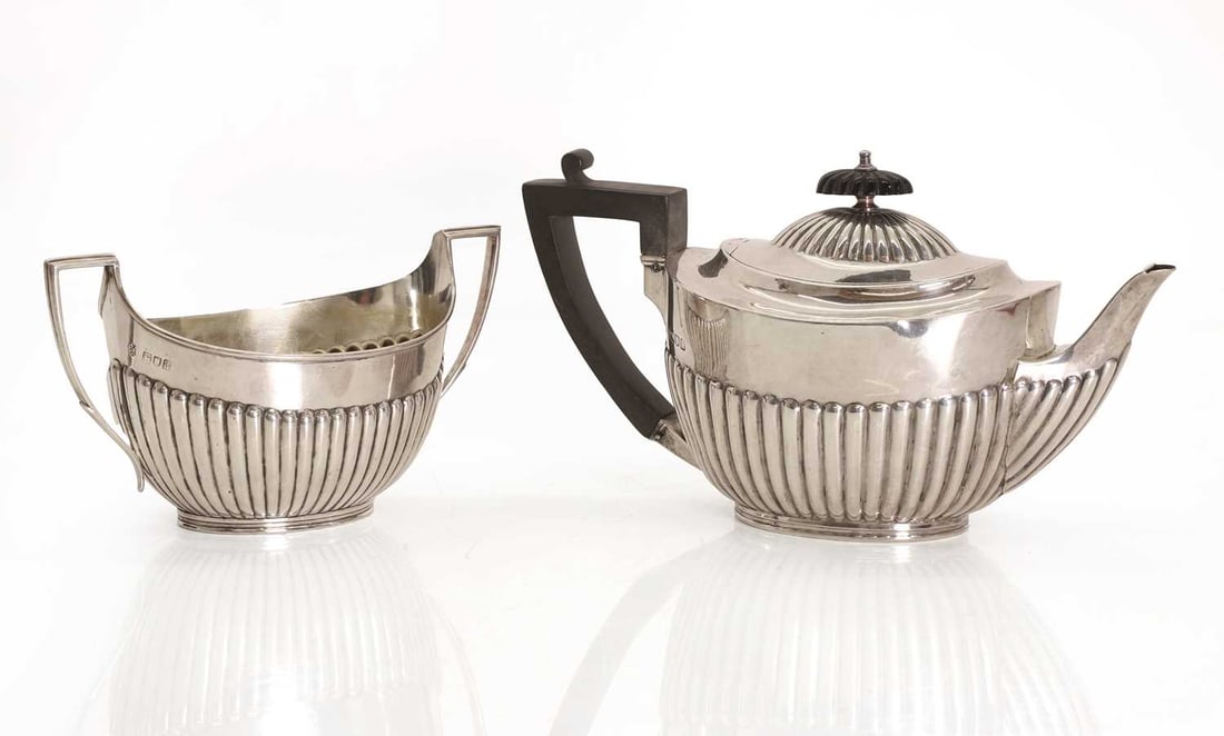A silver teapot and matching sugar bowl, - 2
