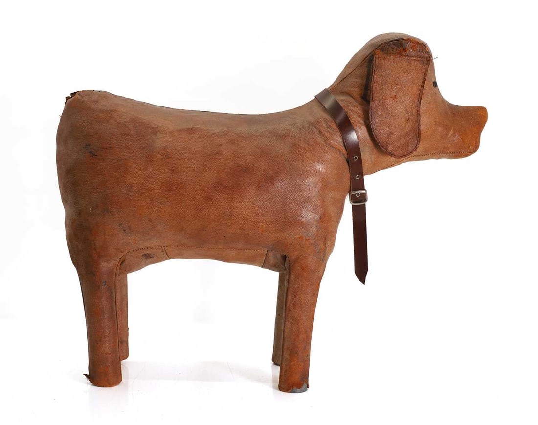 A novelty leather footstool, 20th century, in the manner of Dimitri Omersa for Liberty London, - 2