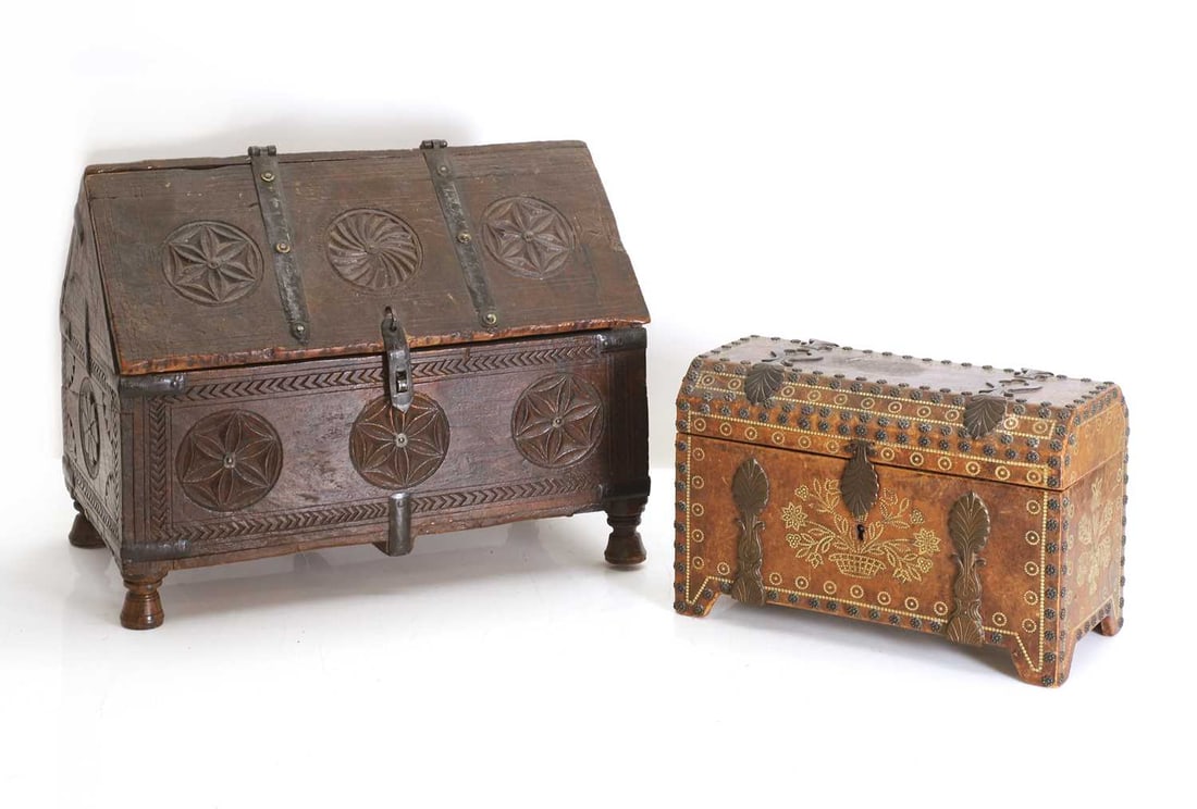 A carved Indian dowry chest, circa 1900,: A carved Indian dowry chest, circa 1900, iron mounted, on turned feet, and an embossed and leather casket, with metal mounts, stamped 'La Marquise De Sevigne, Paris' dowry, 37cm wide, 21cm deep, 30cm 