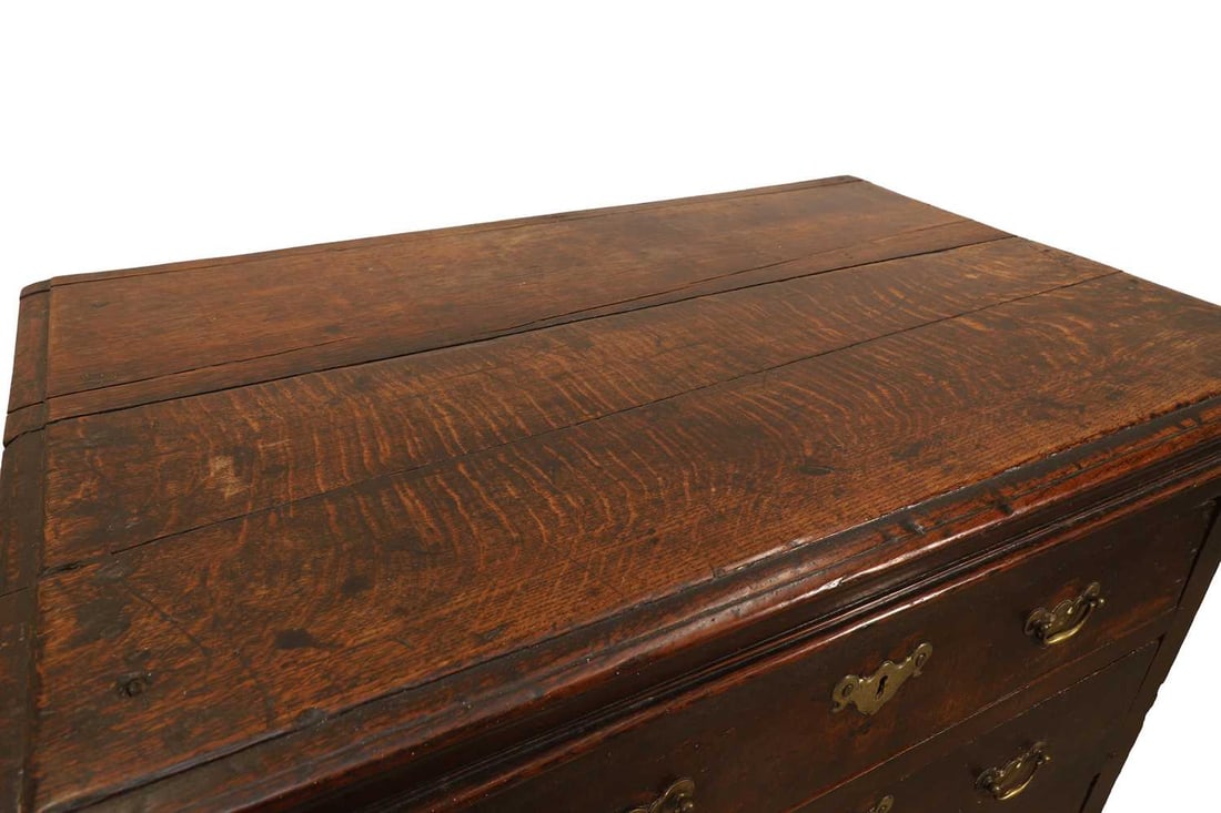 A George I oak chest of three drawers, early 18th century, - 2