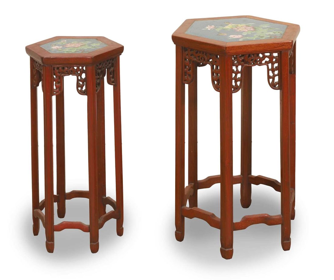 Two Chinese cloisonne topped occasional tables, 20th century,: Two Chinese cloisonne topped occasional tables, 20th century, of hexagonal form, with a red painted frame and blue ground cloisonne top decorated with blossoms and butterflies The largest, 35cm wide,