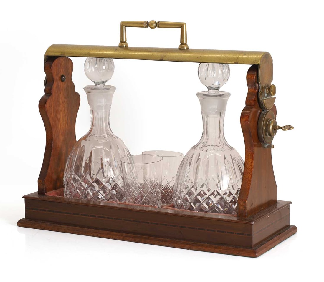 A mahogany and brass tantulus, 20th century, (1 of 2)