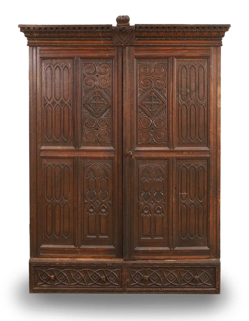 A Gothic carved cupboard, 19th century, French,: A Gothic carved cupboard, 19th century, French, with carved panelled doors, carved with the date 1831 91cm wide, 23cm deep, 114cm high Provenance: The contents of Thornton House, Clare. Condition