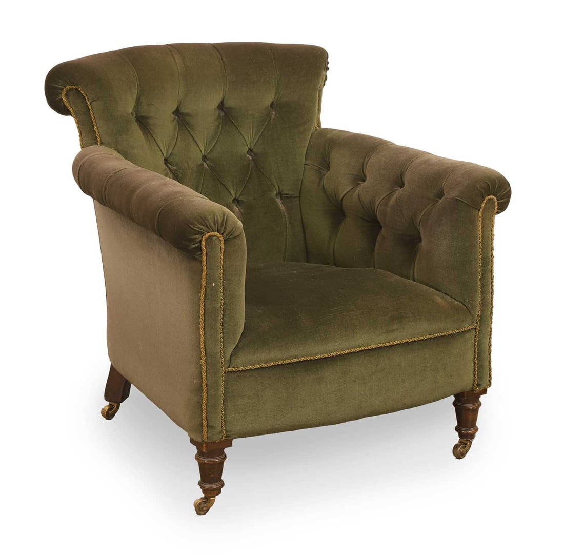 An Edwardian armchair, early 20th century,: An Edwardian armchair, early 20th century, in the manner of Howard & Sons, ‘Woodstock’ model, on turned fore supports terminating in castors 77.5cm wide, 80cm deep, 80cm high, seat