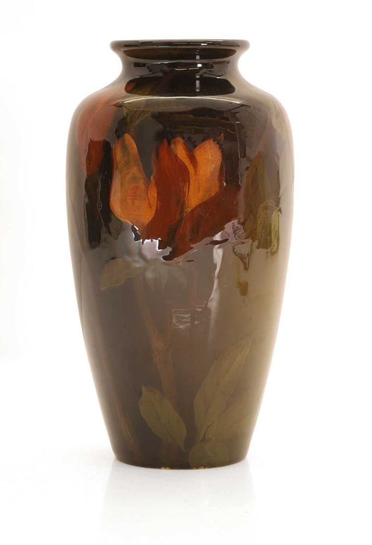 A Rookwood Pottery vase, circa 1900, designed by Amelia Browne Sprague,: A Rookwood Pottery vase, circa 1900, designed by Amelia Browne Sprague, of baluster form, decorated in brown and ochre glazes with flowers, impressed marks and artist's monogram and numbered '614D' 26