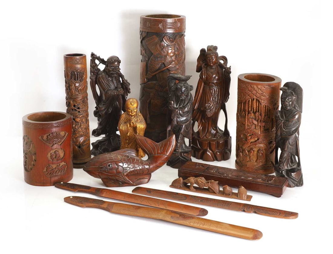 A collection of Chinese wood and bamboo items, 19th/20th century,: A collection of Chinese wood and bamboo items, 19th/20th century, four bamboo brush pots, two carved and wire-inlaid figures, a gilt figure, three bamboo letter openers, a wood case, two further