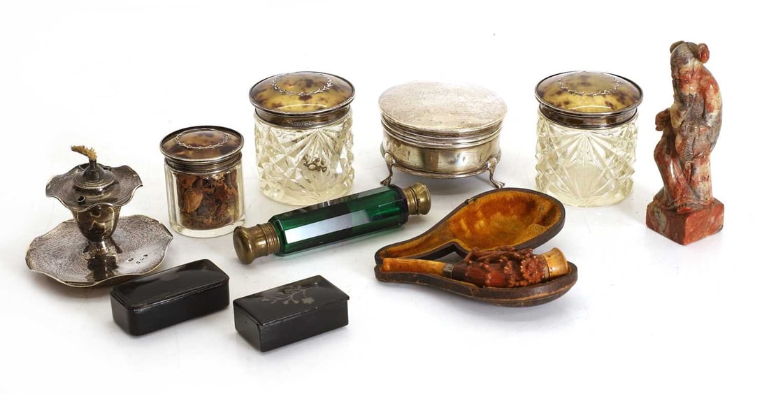 A small silver go to bed marked 'lancha Madrid' 19th century,: A small silver go to bed marked 'lancha Madrid' 19th century, together with a green glass double ended scent bottle, three silver topped jars, a silver ring box a meersham pipe etc. the go to bed