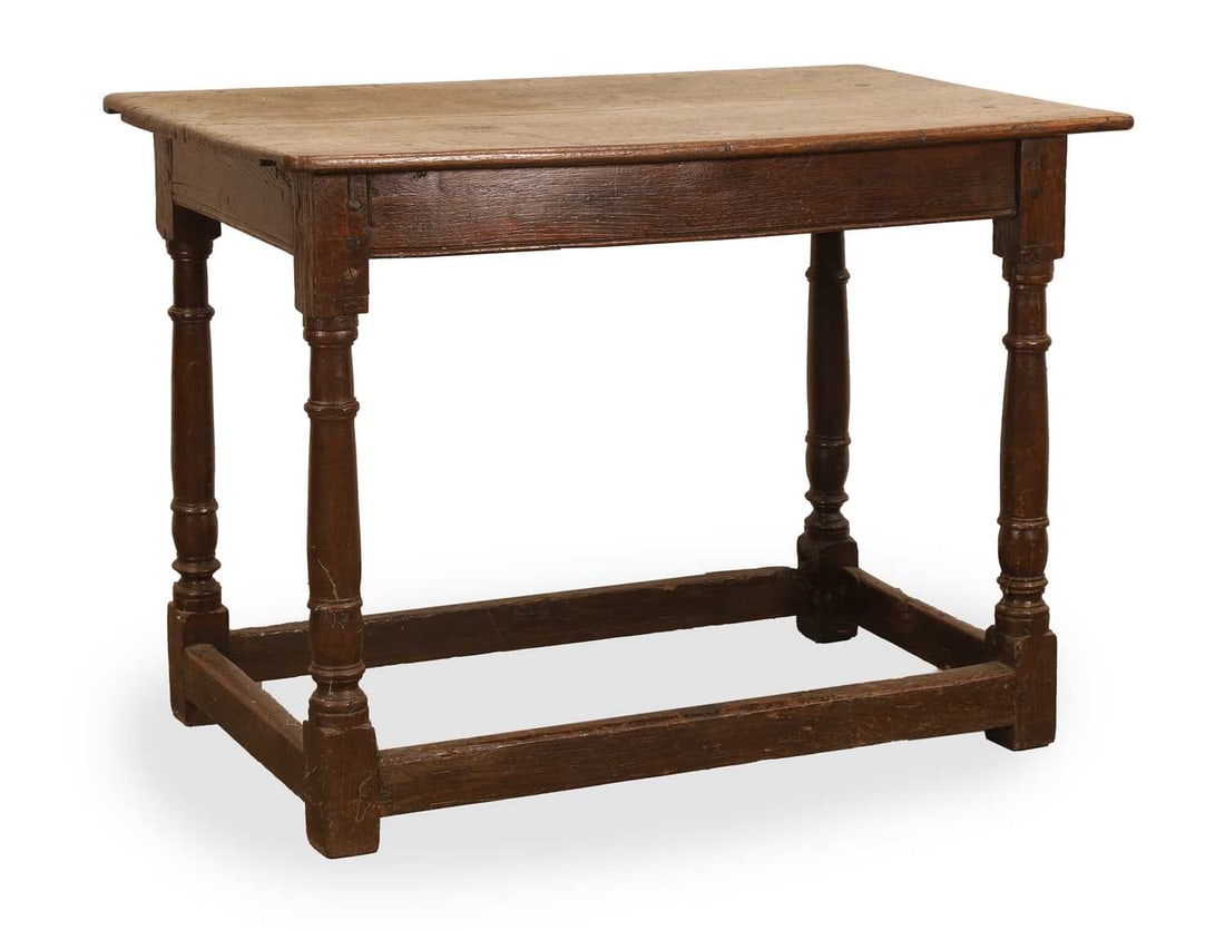 An oak side table, 18th century,: An oak side table, 18th century, turned baluster supports, united by stretchers 93cm wide, 54cm deep, 70cm high Provenance: The contents of Thornton House, Clare. Condition Report: the top possibly