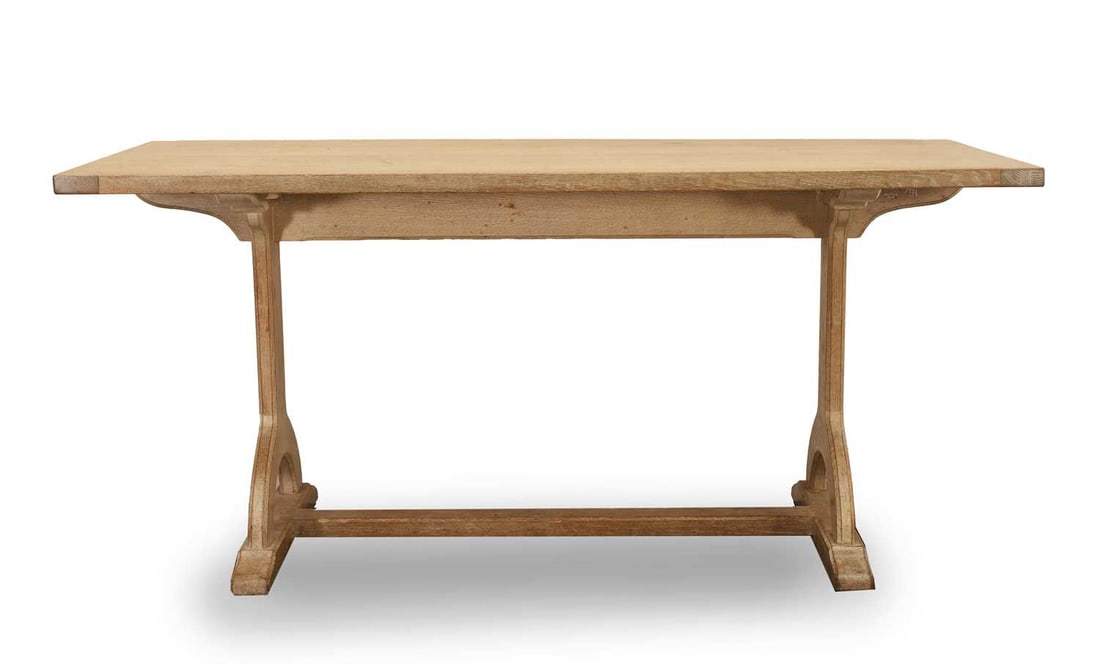 A limed oak kitchen table, 20th century,: A limed oak kitchen table, 20th century, raised on shaped end supports, the cleated two plank top with central support 79cm wide, 178cm deep, 82cm high Provenance: The contents of Thornton House,