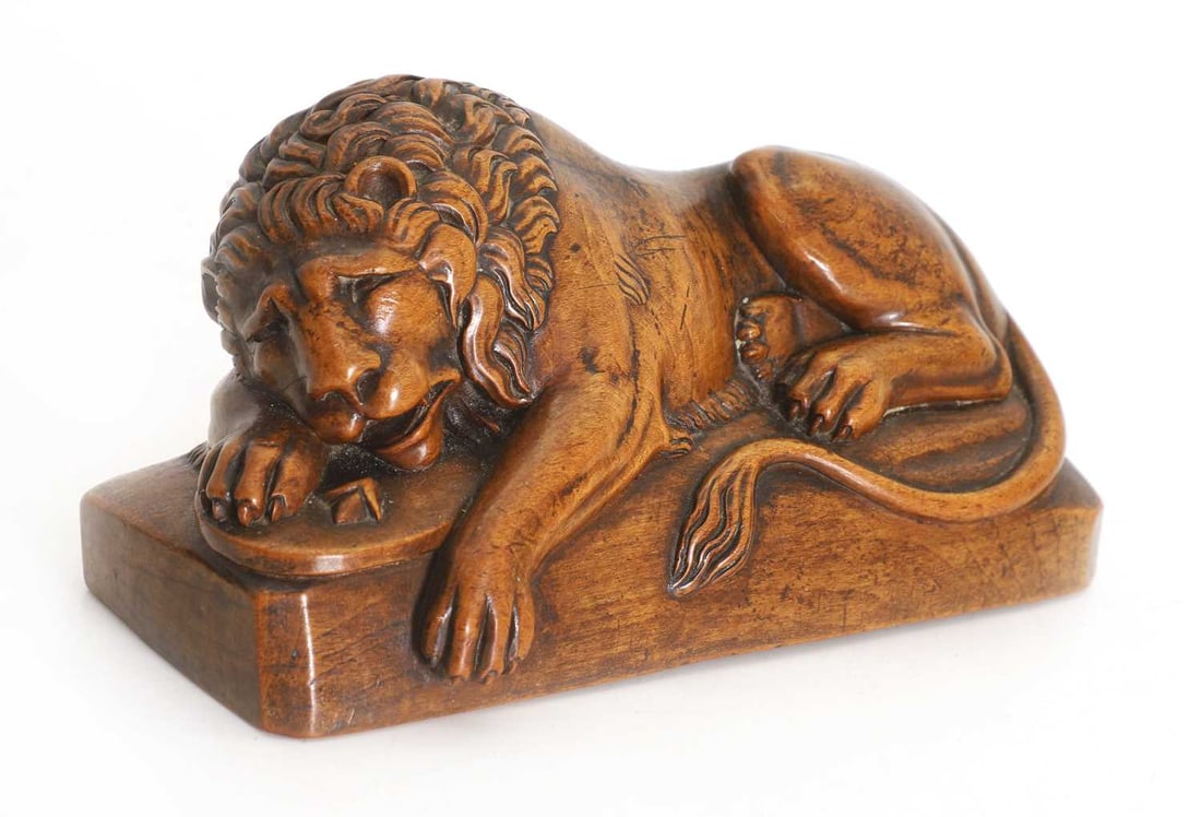 'The Lion of Lucerne', circa 1900,: 'The Lion of Lucerne', circa 1900, modelled after the 'The Lion of Lucerne', a carved wodden figure of a resting lion 18.5cm wide, 8cm deep, 9.5cm high