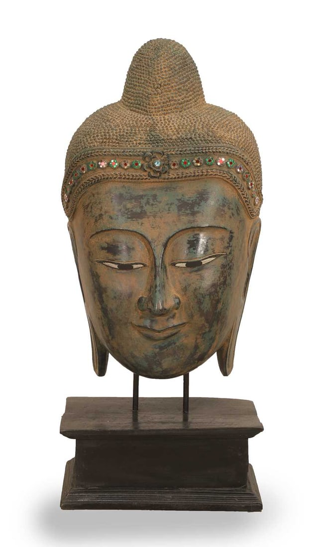 A painted composite Buddha head, of recent manufacture,: A painted composite Buddha head, of recent manufacture, with mirrored glass detail, on a stepped plinth 45cm wide, 26cm deep, 103cm high Condition Report: General light surface wear. Solid and