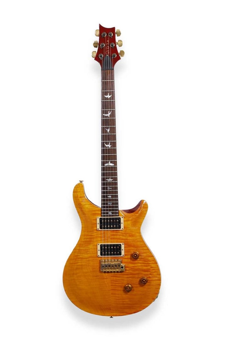 A 1992 Paul Reed Smith PRS Custom electric guitar,: A 1992 Paul Reed Smith PRS Custom electric guitar, serial number 2 1***3, the double cutaway body with figured maple top in a rich honey colour finish, with 24 fret neck and bird inlays