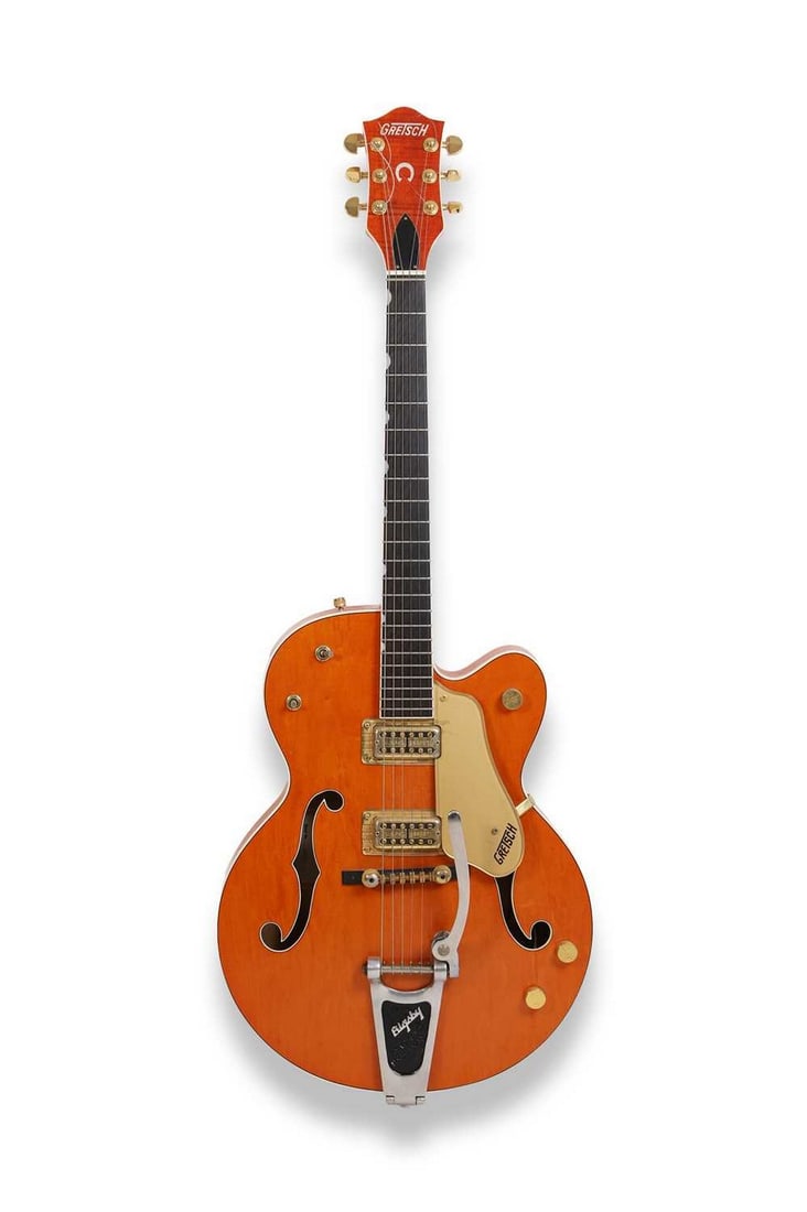 A 1995 Gretsch 6120 -60 'Country Gentleman' electric guitar,: A 1995 Gretsch 6120 -60 'Country Gentleman' electric guitar, serial number 95*****60, the double cutaway body with a burnt orange finish, with fitted hardcase