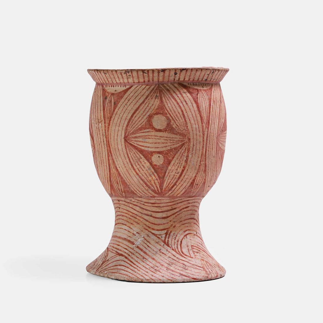A Thai earthenware pedestal bowl, possibly Middle Period, circa 900-300 BCE, Ban Chiang,: A Thai earthenware pedestal bowl, possibly Middle Period, circa 900-300 BCE, Ban Chiang, the ovoid body rising to a short everted rim, painted with buff slip and red oxide decoration 22.5cm high