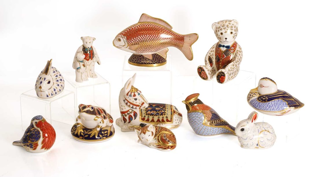 A collection of eleven Royal Crown Derby porcelain paperweights, (1 of 2)
