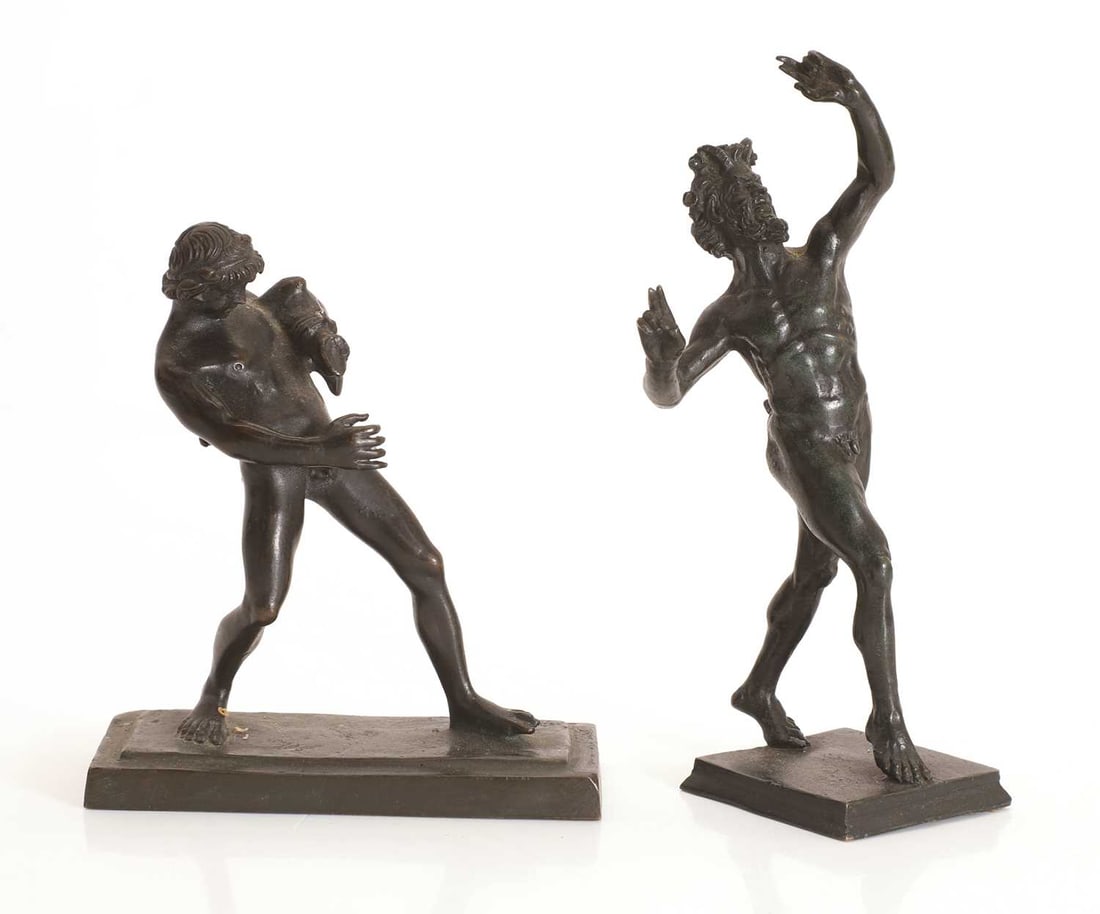 A near pair of Grand Tour bronze figures, late 19th to early 20th century,: A near pair of Grand Tour bronze figures, late 19th to early 20th century, one modelled as a faun with a wine skin, the second modelled a faun with arms raised Largest, 6cm wide, 16cm high 2