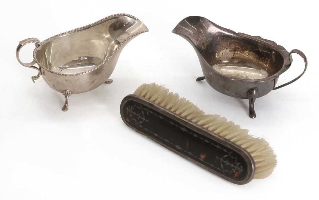 A silver sauce boat,: A silver sauce boat, by Mappin & Webb, Birmingham 1926, with beaded rim, together with one other sauce boat by Viner's Ltd (Emile Viner), Sheffield, 1966, and a silver and tortoiseshell clothes br