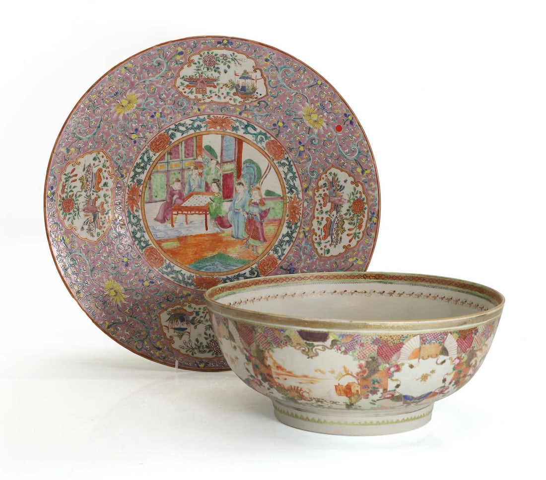 A Chinese famille rose charger, 19th century,: A Chinese famille rose charger, 19th century, the centre painted with a circular panel depicting a scene of figures playing a game in a garden, surrounded by a border of scrolling lotus and peony,