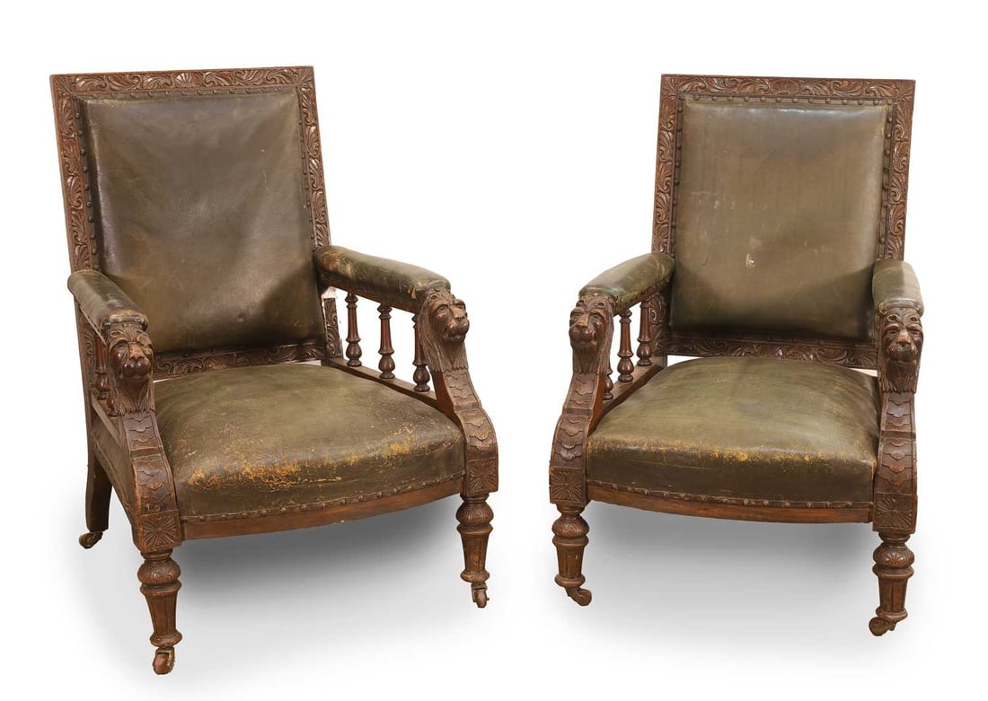 A pair of Victorian carved oak and leather armchairs, 19th century, (1 of 2)