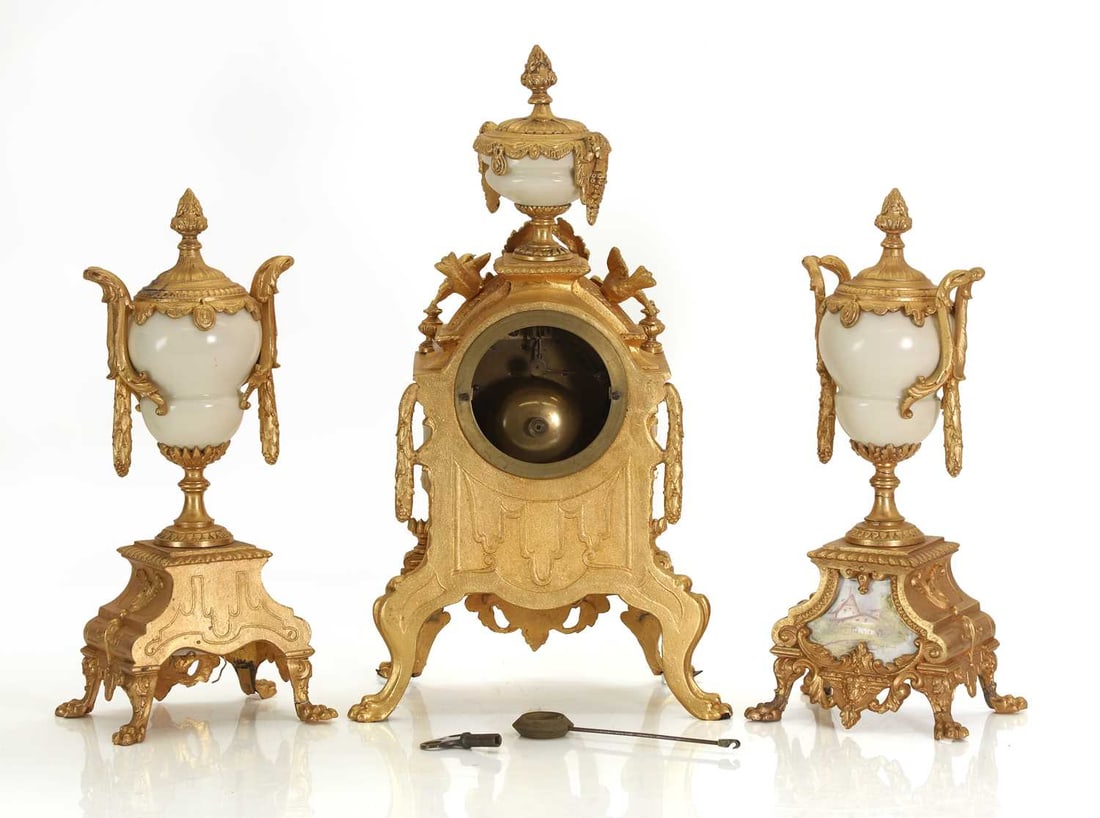 A French gilt metal clock garniture inset with porcelain panels, late 19th century, - 2