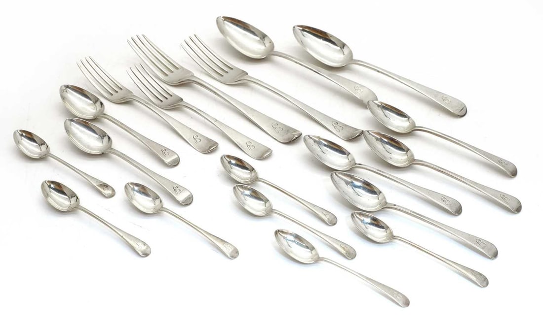 A harlequin part canteen of silver cutlery,: A harlequin part canteen of silver cutlery, mixed hallmarks predominantly Georgian, three forks, London, 1807, makers marks rubbed, two tablespoons by Thomas Austin, London, 1820, initialled to the