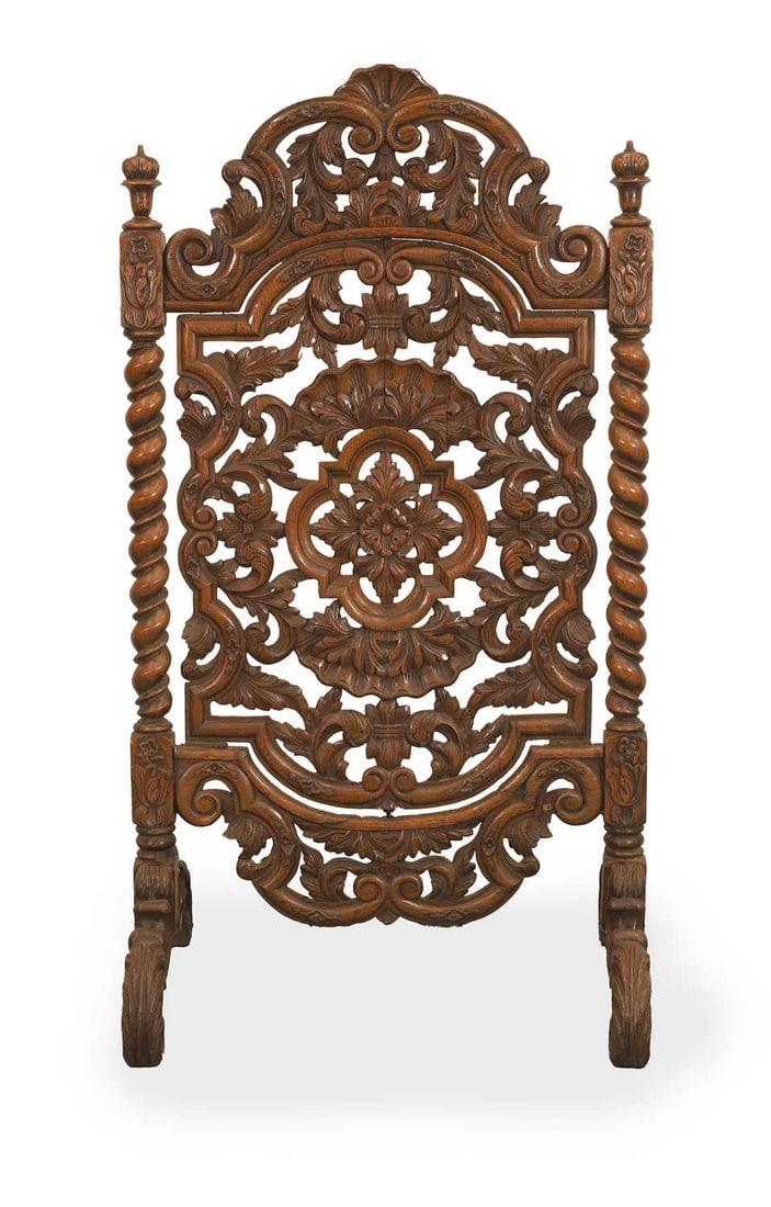 A pierced walnut fire screen, 19th century,: A pierced walnut fire screen, 19th century, with all-over foliate carving and barley twist side supports, terminating on scrolled supports 63cm wide, 115cm high Provenance: The contents of Thornton