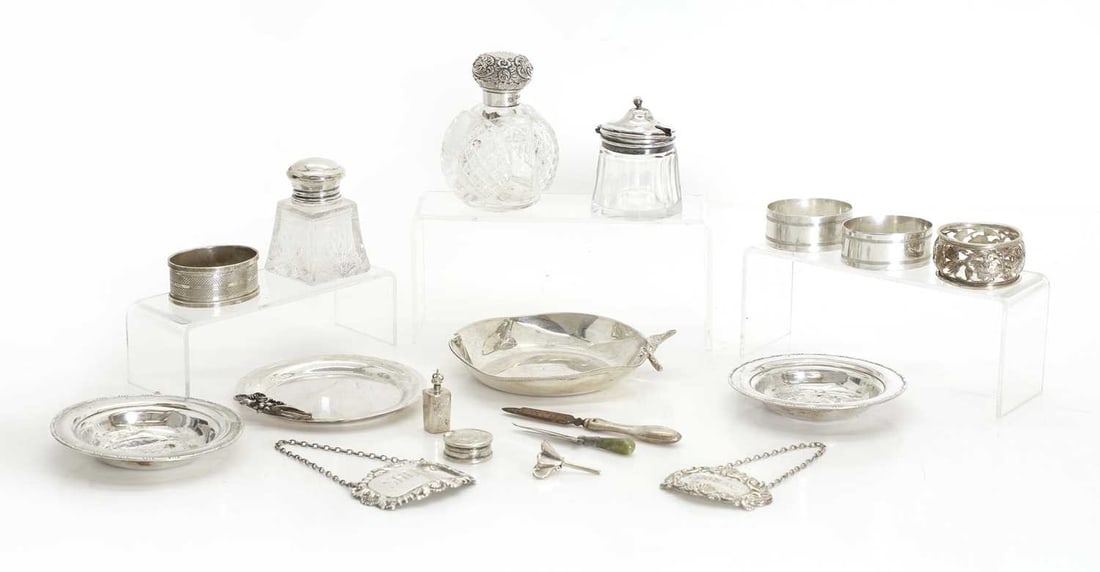 A collection of silver and silver-mounted pieces,: A collection of silver and silver-mounted pieces, to include napkin rings, some by John Rose, Birmingham, 1927, ship dishes for Stella Polaris stamped 8.30 and cut glass and silver mounted scent bottl