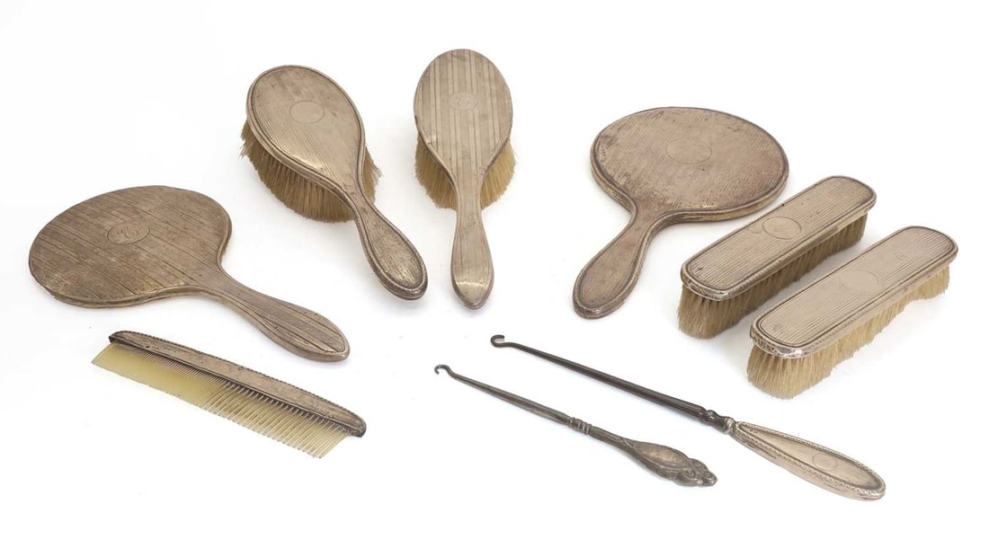 A seven piece silver dressing table set,: A seven piece silver dressing table set, by Synyer & Beddoes (Harry Synyer & Charles Joseph Beddoes), Birmingham 1925, all wiht engine turned design, together with two similar button hooks