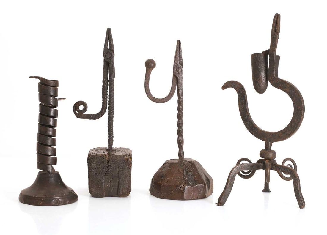 A group of four wrought iron lighting devices, 18th century, (1 of 2)