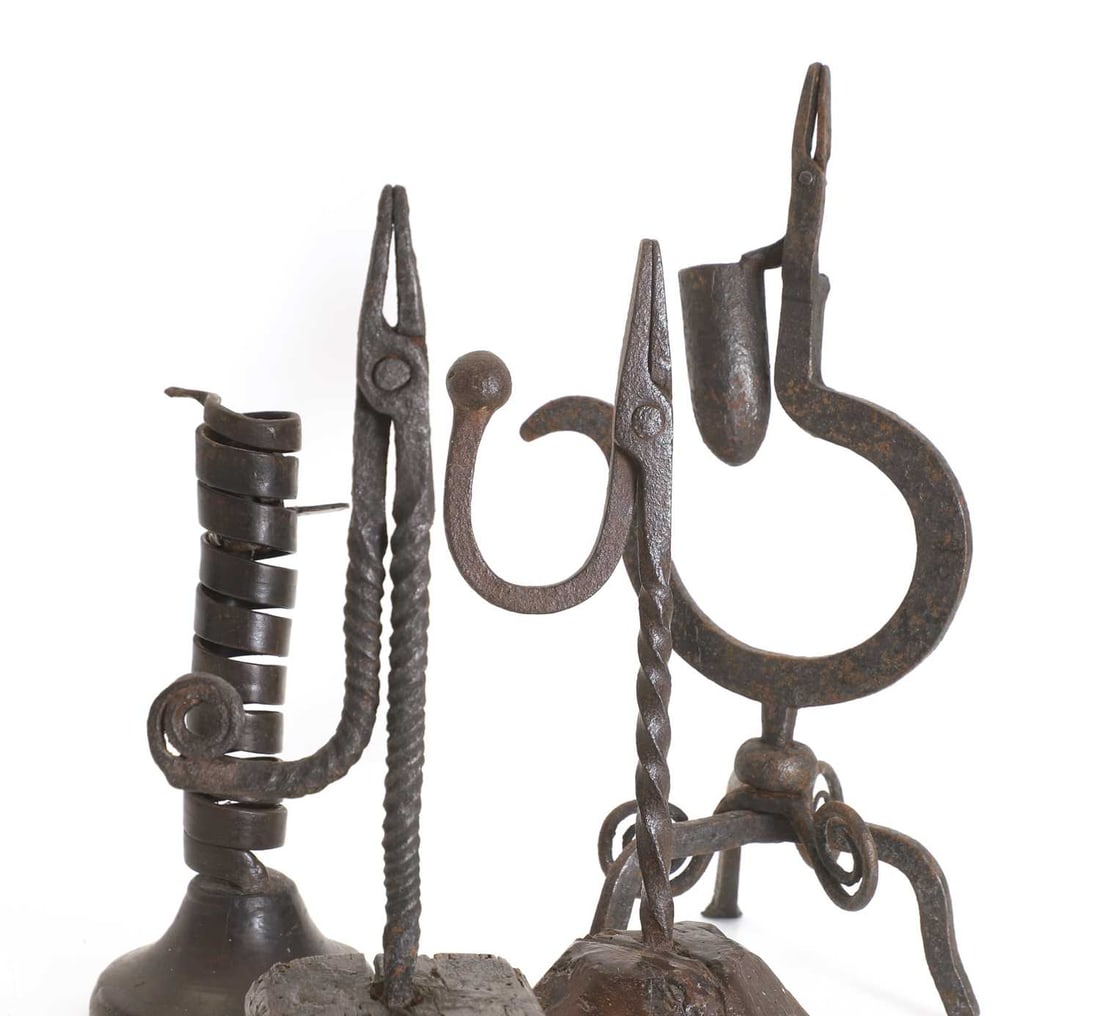 A group of four wrought iron lighting devices, 18th century, - 2