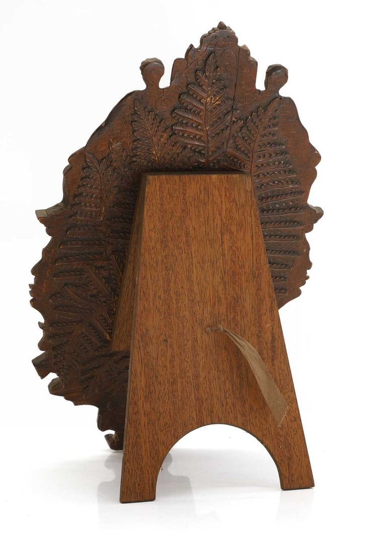 A carved oak easel back mirror, 19th century, - 2
