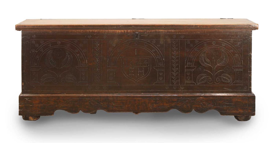 A carved wooden chest,: A carved wooden chest, inscribed 'E.H. 1644', and with craved details, terminating with bracket feet 148cm wdie, 42cm deep, 57.5cm high Condition Report: Some historic repairs to the sides and the