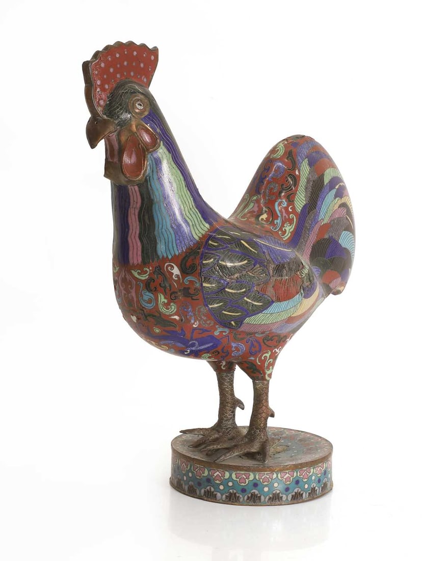 A Chinese cloisonné enamel model of a rooster, 20th century,: A Chinese cloisonné enamel model of a rooster, 20th century, cast standing with a dark red comb and wattle, the feathers naturalistically detailed amongst scrolls, on a circular base 42cm high