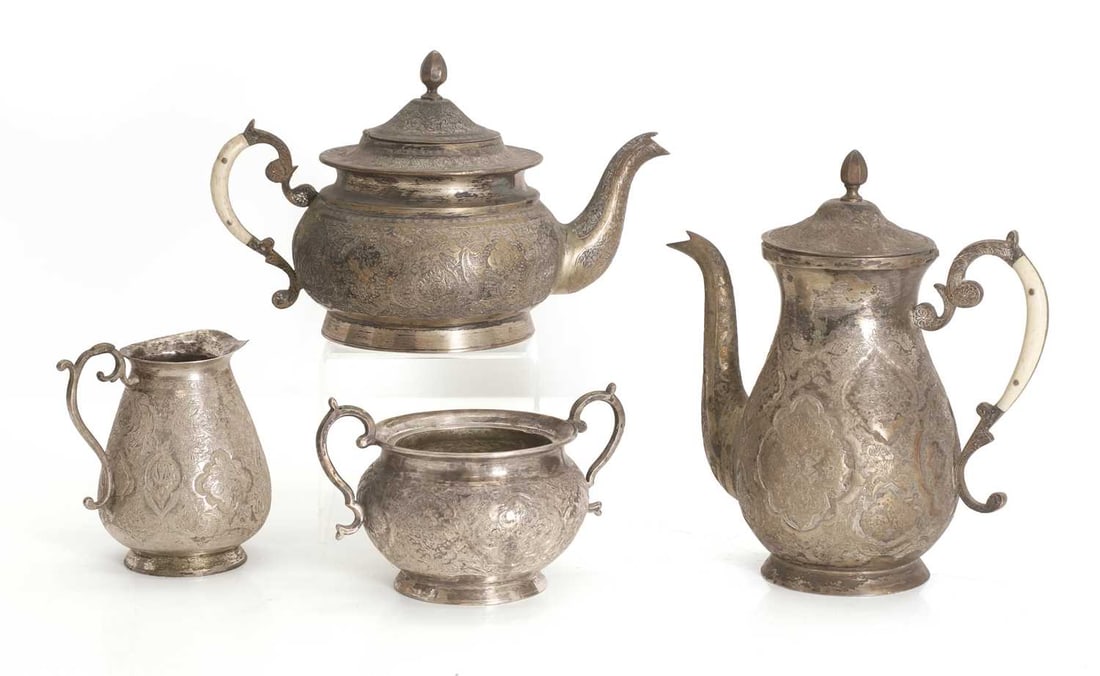 A Middle Eastern silver four piece service,: A Middle Eastern silver four piece service, possibly Turkish, four pieces comprising a teapot and coffee pot, both with bone veneered handles, a white metal bowl, and a milk jug, all with stamp marks 