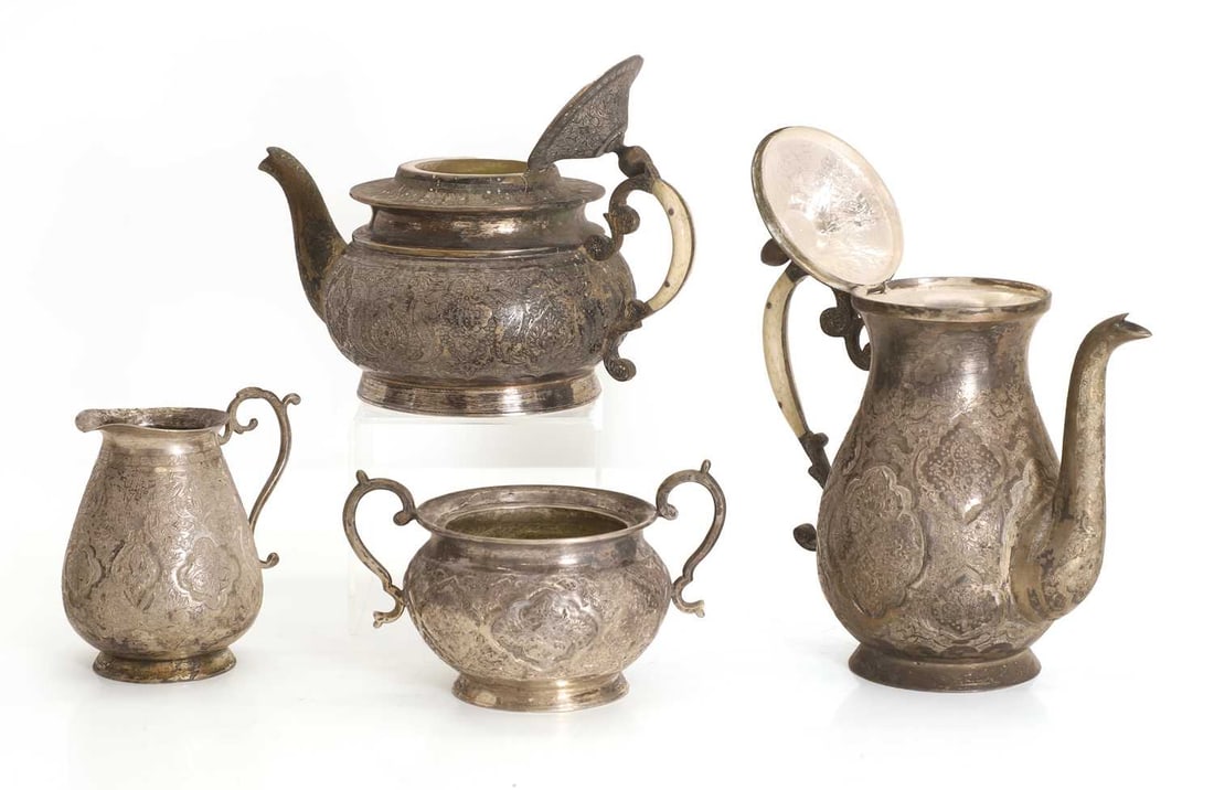 A Middle Eastern silver four piece service, - 2
