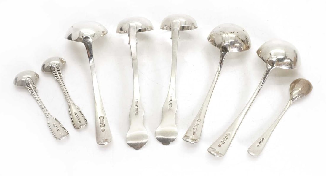 A collection of silver spoons and ladles, - 2