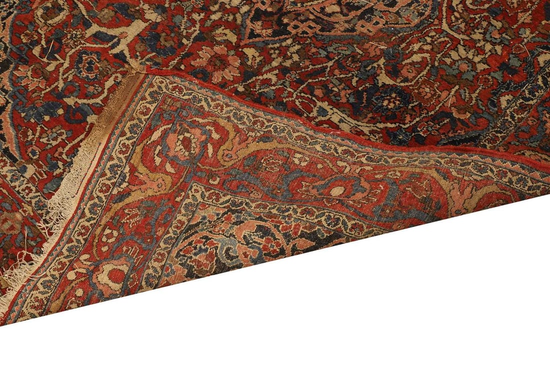 A Kashan wool rug, - 2