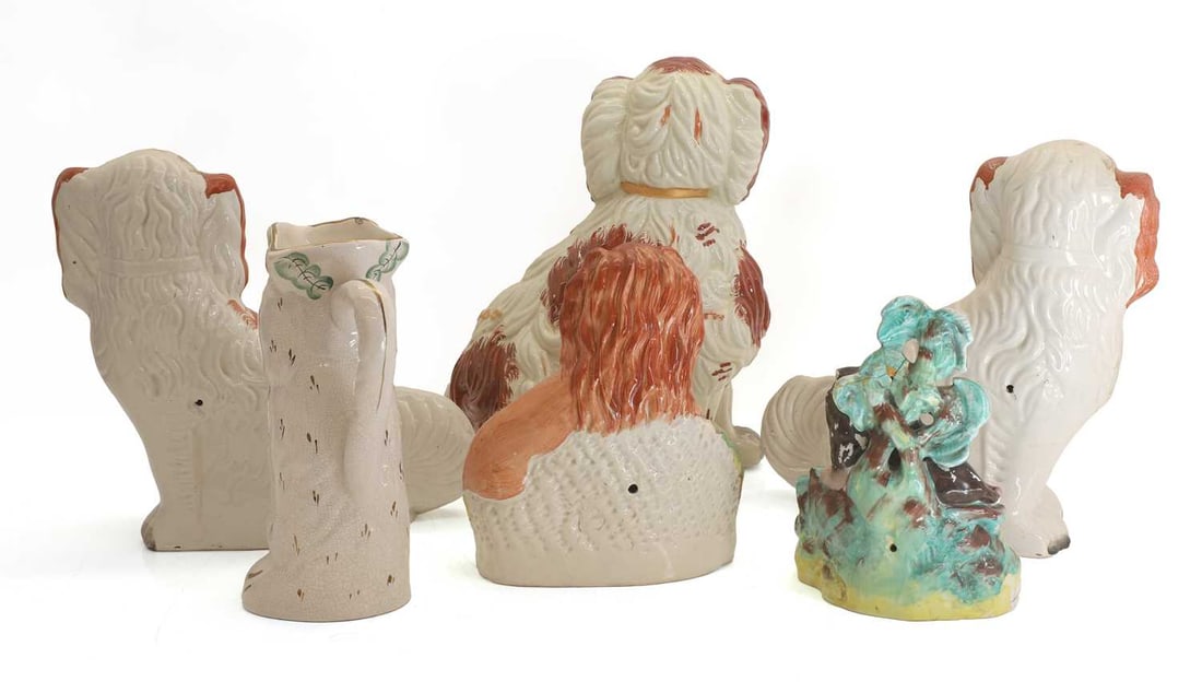 A pair of Staffordshire spaniels, late 19th century and later, - 2